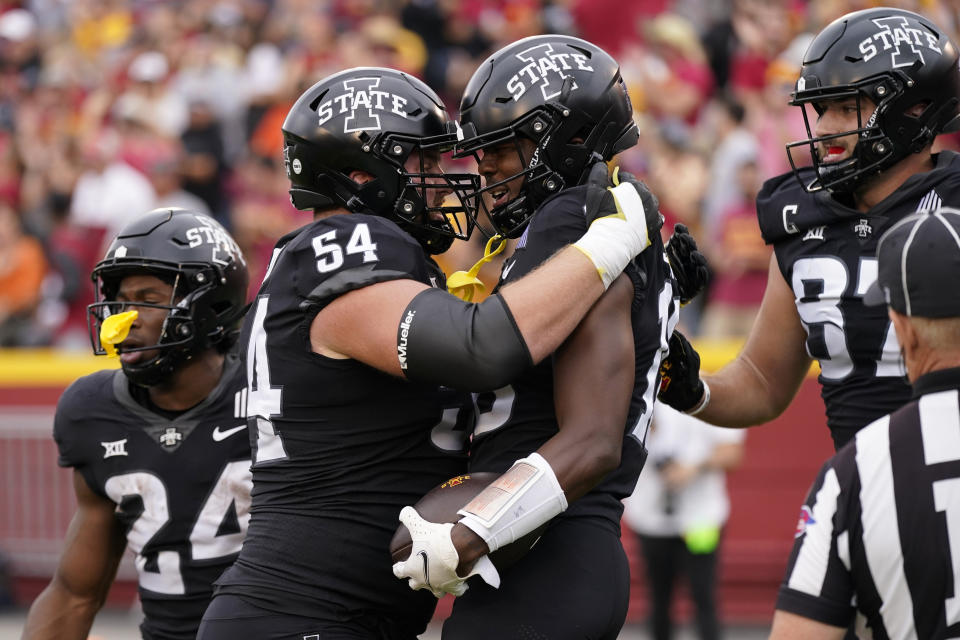 Iowa State wide receiver Daniel Jackson celebrates with teammate offensive lineman Jarrod Hufford (54) after catching a 29-yard touchdown pass during the first half of an NCAA college football game against Oklahoma State, Saturday, Sept. 23, 2023, in Ames, Iowa. (AP Photo/Charlie Neibergall)
