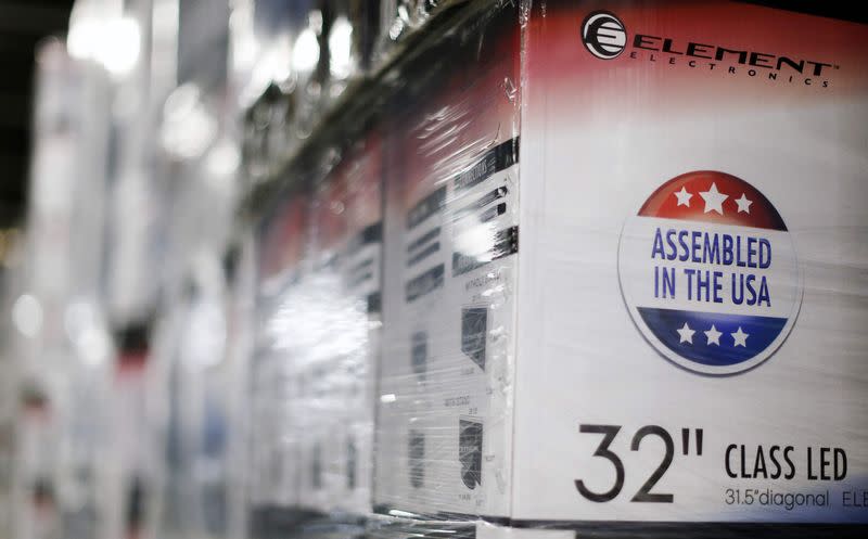 An "Assembled in the USA" stamp is seen at the side of a box containing a 32-inch television set in the warehouse of Element Electronics, in Winnsboro, South Carolina May 29, 2014. REUTERS/Chris Keane