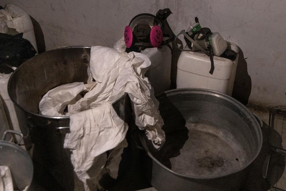 Heavy pots and respirator masks in a makeshift lab in Culiacán, Mexico, where fentanyl had been made. November 2023