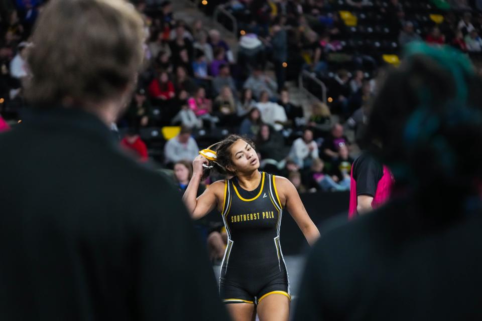 Southeast Polk’s Skylar Slade walks off the mat after defeating Missouri Valley’s Nicole Olson at 155 pound during the semifinals of the IGHSAU state girls wrestling tournament.