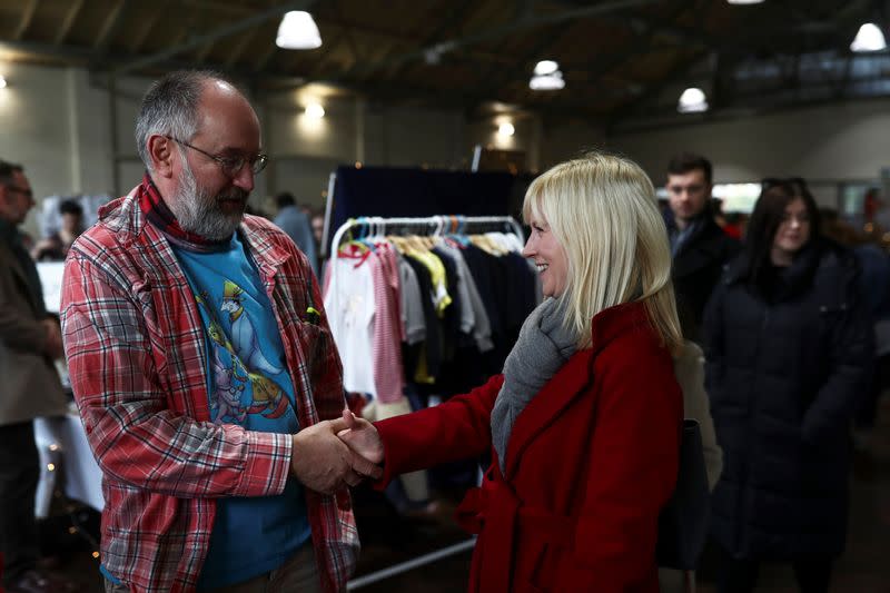 Rosie Duffield speaks to a stall holder at an Etsy market in Canterbury