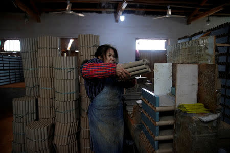 A worker processes pyrotechnic product at Liuyang Standard Fireworks Manufactory in Liuyang, Hunan province, China January 29, 2018, Picture taken January 29, 2018. REUTERS/Aly Song