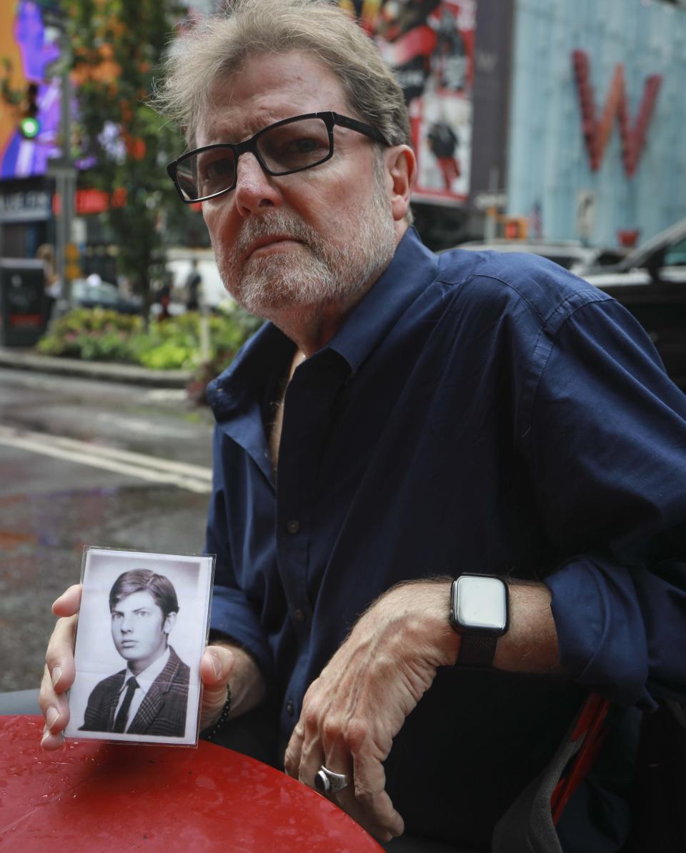 Brian Toale, a 66-year-old who says he was molested by an employee at a Catholic high school in Long Island, holds a photo of himself at 16 years old.&nbsp; (Photo: Bebeto Matthews/ASSOCIATED PRESS)