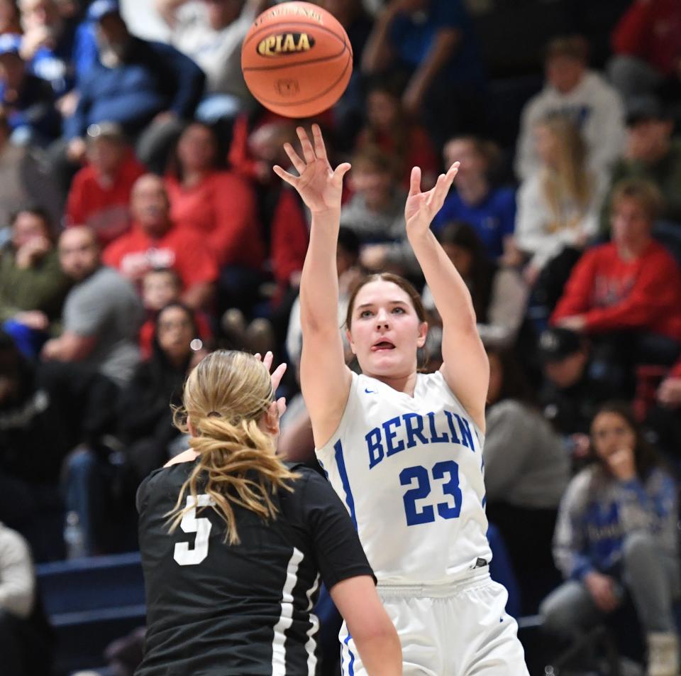 Berlin Brothersvalley's Taylor Hillegass shoots over Northen Bedford County defender Lacy McIlnay (5) in the District 5 Class 1A girls basketball championship, March 2, at Pitt-Johnstown.