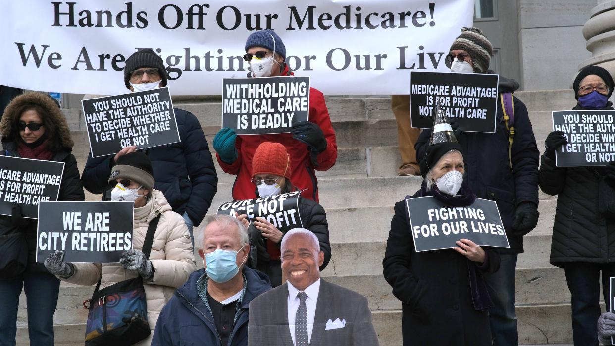 Retired New York City municipal workers are pictured on the steps of Brooklyn Borough Hall to call on New York City Mayor-elect Adams to preserve their Medicare coverage last December. 