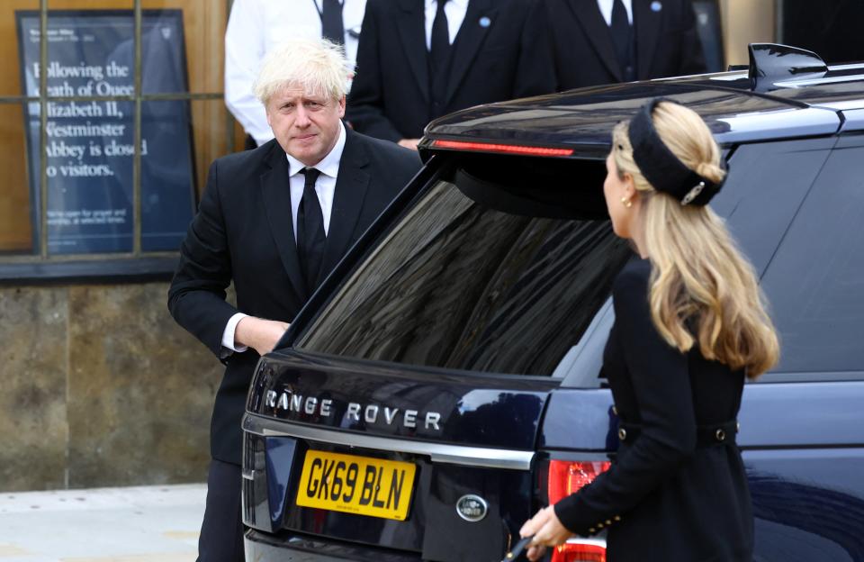 File: Former British prime minister Boris Johnson and his wife Carrie walk outside the Westminster Abbey on 19 September 2022 (Getty Images)