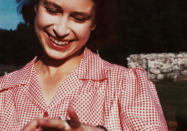 <p>Princess Elizabeth shows her engagement ring from Prince Philip during a visit to Balmoral in 1946.</p>