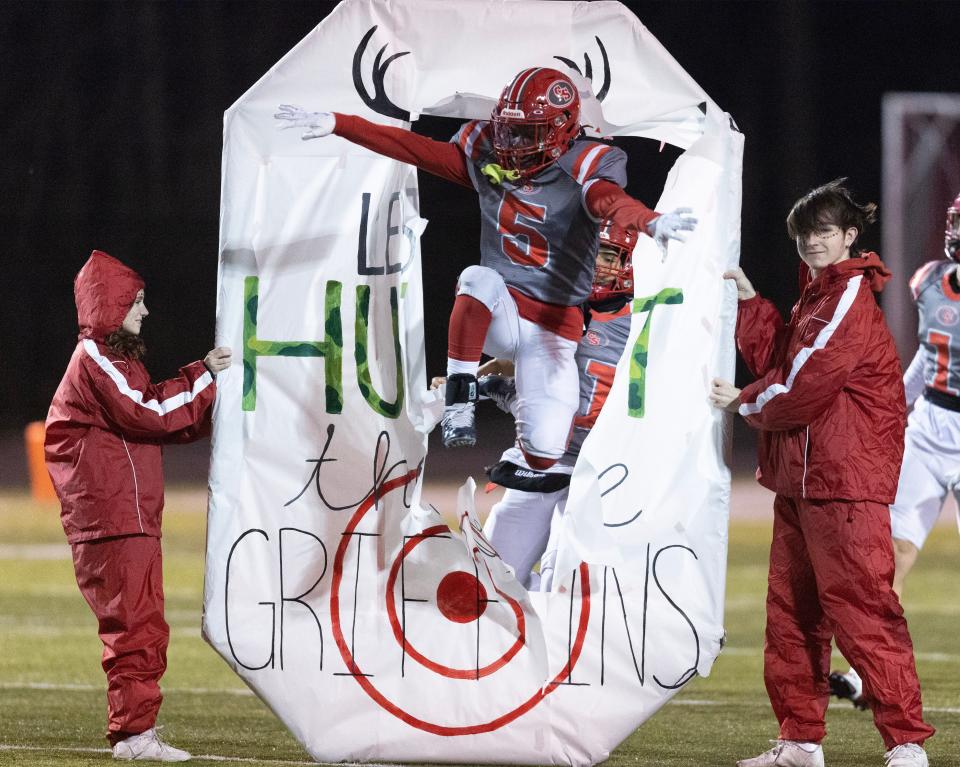 The Canton South Wildcats take the field ahead of a second-round playoff game vs. Buchtel.