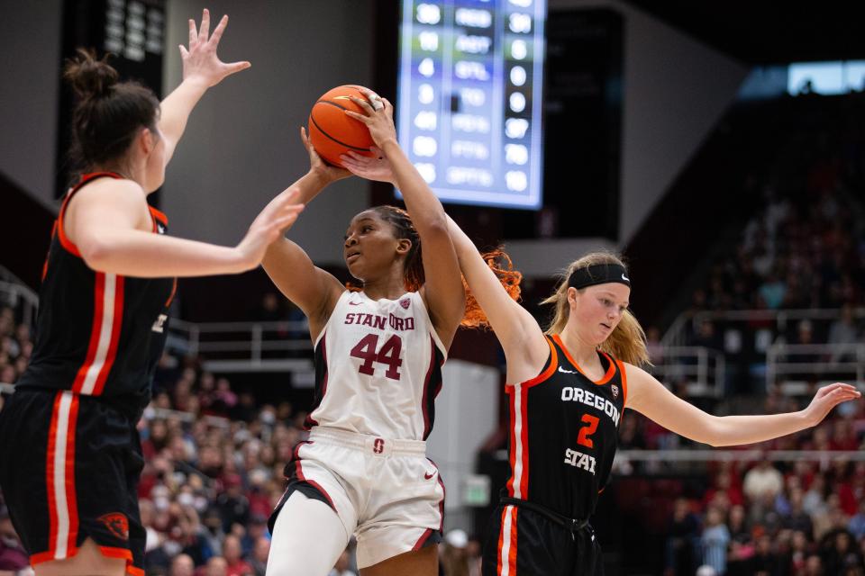 Jan 21, 2024; Stanford, California, USA; Stanford Cardinal forward Kiki Iriafen (44) tries to shoot between Oregon State Beavers forward Raegan Beers (left) and guard Lily Hansford (2) during the fourth quarter at Maples Pavilion. Mandatory Credit: D. Ross Cameron-USA TODAY Sports
