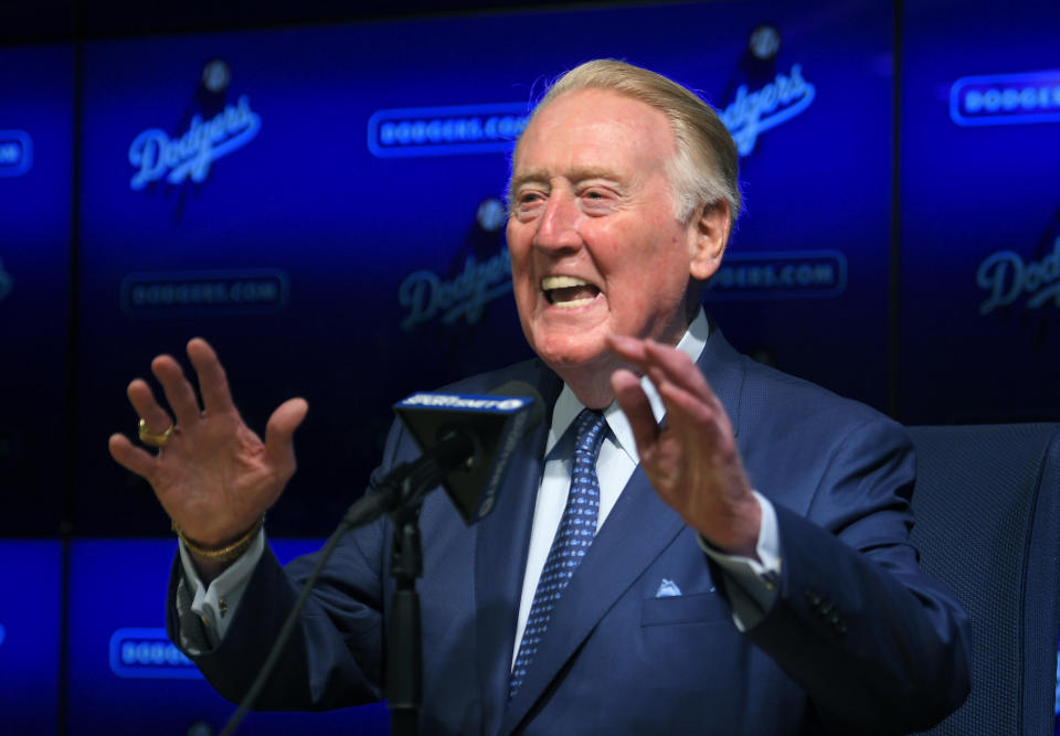 Hall of Fame broadcaster Vin Scully speaks to reporters about being inducted into the Los Angeles Dodgers Ring of Honor, prior to a baseball game between the Dodgers and the San Francisco Giants, Wednesday, May 3, 2017, in Los Angeles. (AP Photo/Mark J. Terrill)