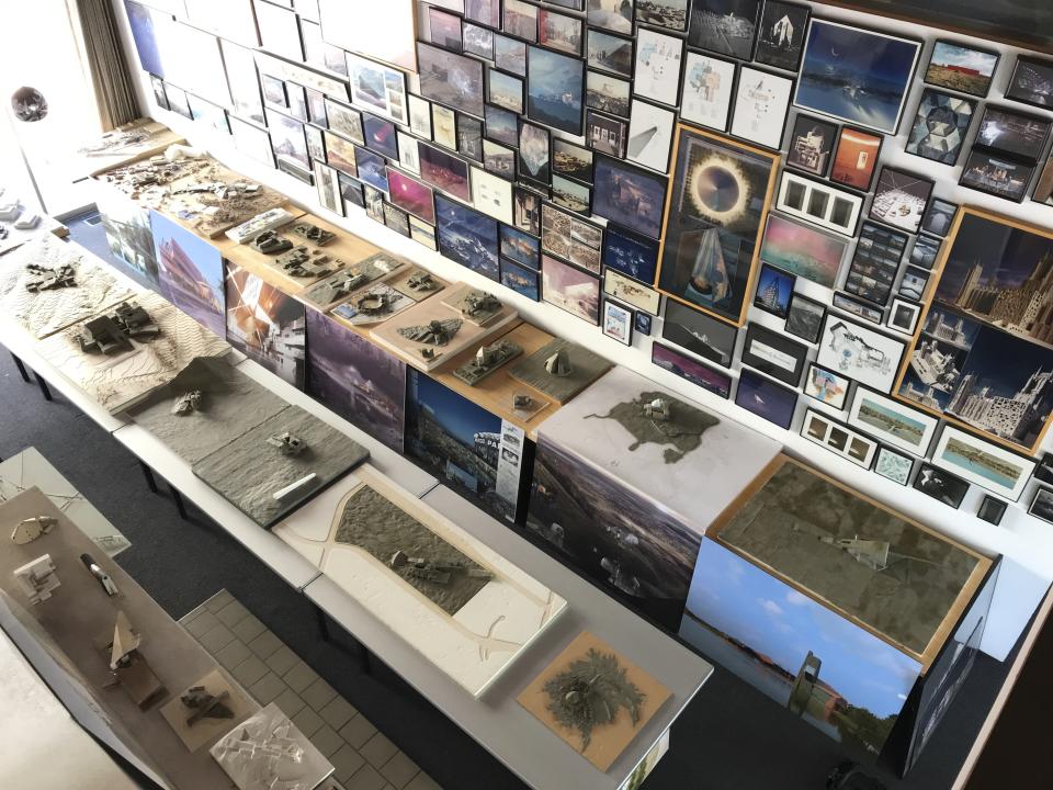 Clay models, photographs and images of inspiration that line the walls of renowned architect Antoine Predock's studio are pictured in Albuquerque, N.M., April 30, 2018. Predock, whose list of credits includes award-winning buildings around the world, died Saturday, March 2, 2024, at his home in Albuquerque, according to longtime friends and colleagues. He was 87. (AP Photo/Susan Montoya Bryan)