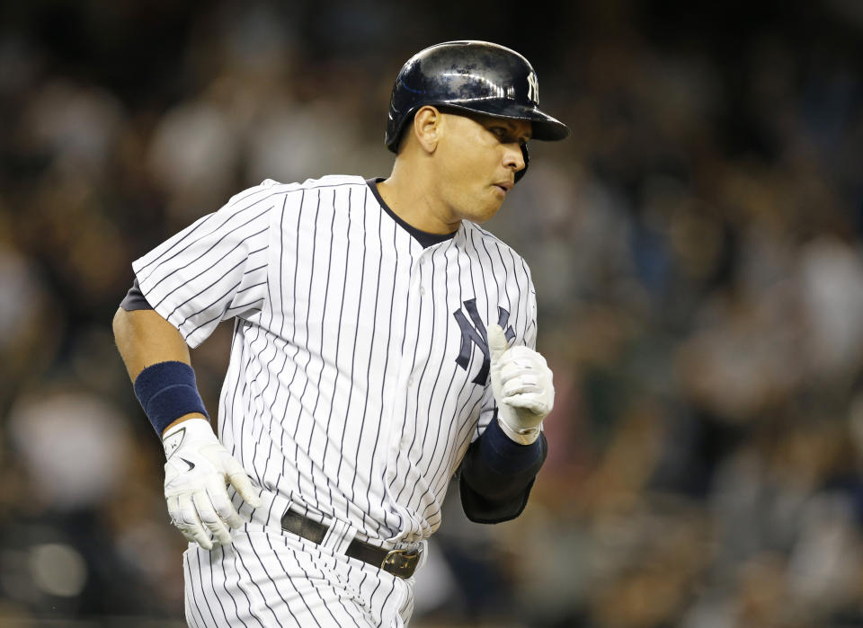 New York Yankees designated hitter Alex Rodriguez after hitting a solo-home run off Boston Red Sox pitcher Matt Barnes during the sixth inning of a baseball game in New York, Wednesday, Sept. 30, 2015.   (AP Photo/Kathy Willens)