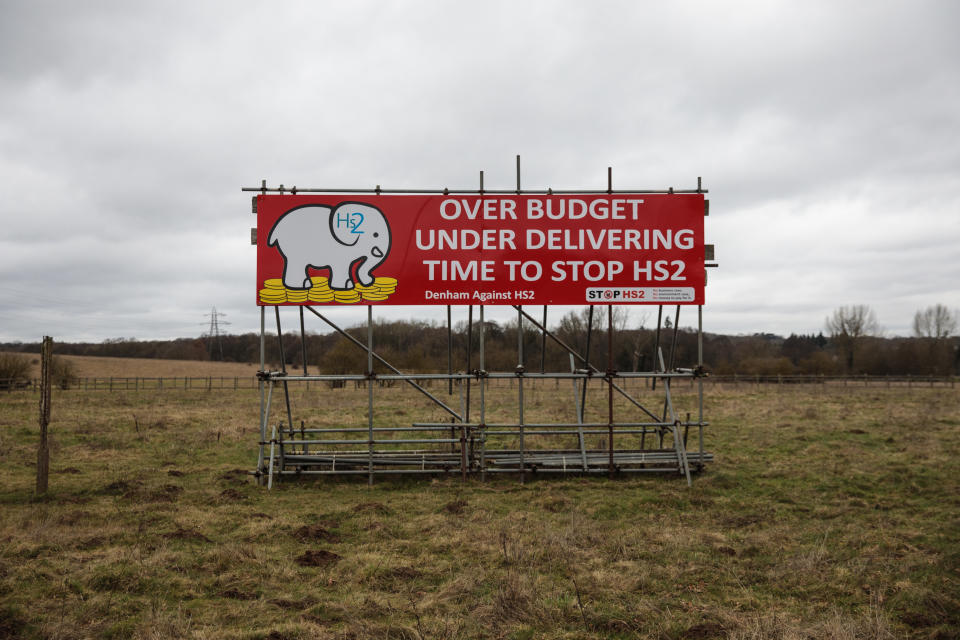 DENHAM, ENGLAND - FEBRUARY 21: A billboard which says 'Time to Stop HS2' stands in a field near to the proposed HS2 route on February 21, 2017 in Denham, England. The HS2 Hybrid Bill, which allows building to begin on the High Speed 2 Rail Network, passes into law on Thursday.  The network will provide a high speed rail link from London to the West Midlands, known as Phase 1, with Phase 2 expected to connect Birmingham with Leeds and Manchester. (Photo by Jack Taylor/Getty Images)