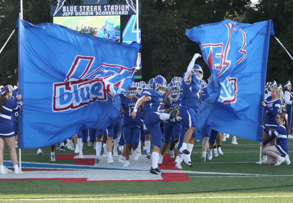 The Lake Blue Streaks take the field for their first game against the Alliance Aviators, Friday, Aug. 18, 2023.