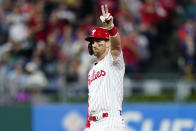 Philadelphia Phillies' Bryce Harper reacts after hitting an RBI-double off Pittsburgh Pirates' Miguel Yajure during the fifth inning of a baseball game, Friday, Sept. 24, 2021, in Philadelphia. (AP Photo/Matt Slocum)