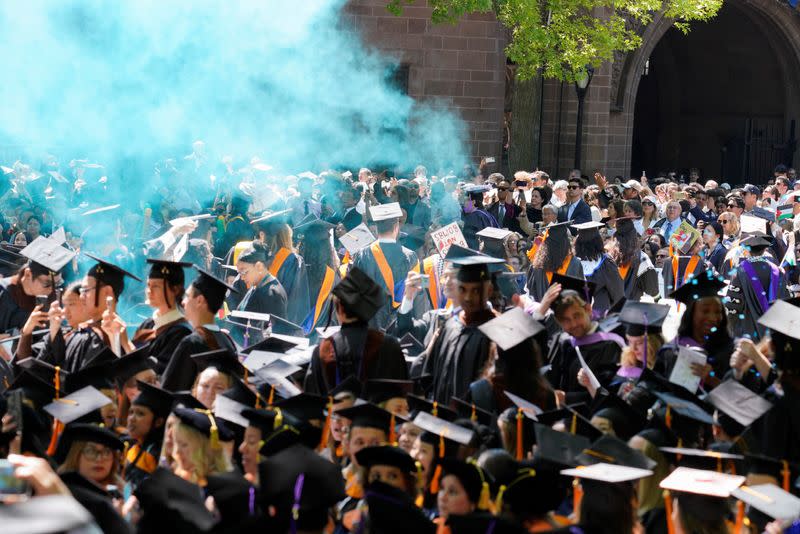 Graduates protest the conflict between Israel and the Palestinian Islamist group Hamas, during the commencement at Yale University