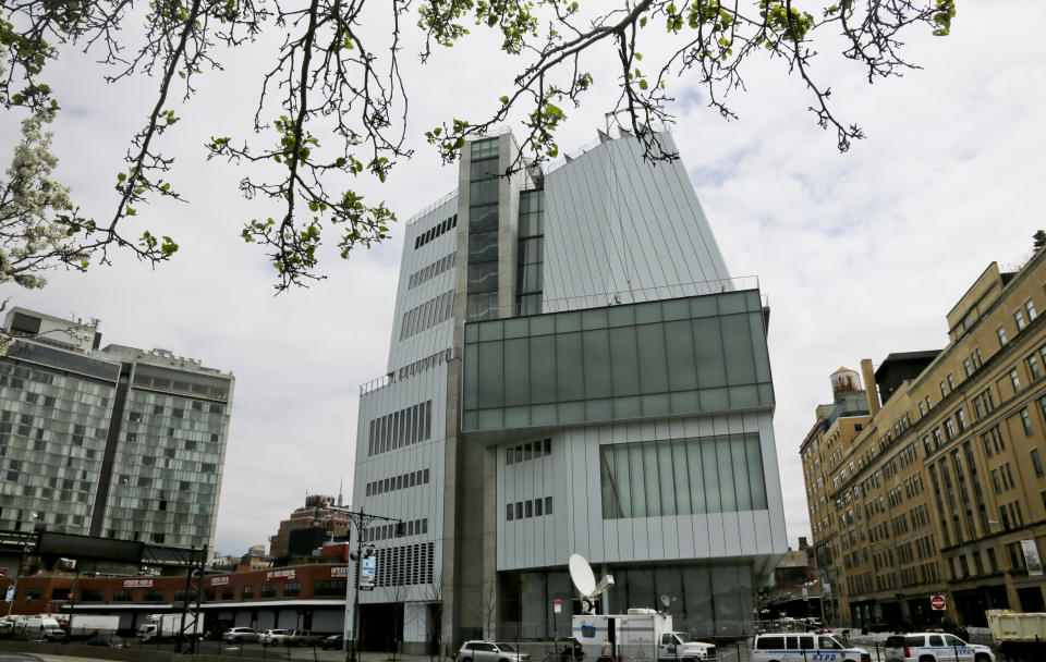 FILE- This April 30, 2015 photo shows an exterior view of the Whitney Museum of American Art in New York. Seven artists have asked the museum to remove their work from its biennial showcase of American art over a museum board member's ties to the sale of law-enforcement supplies including tear gas. (AP Photo/Bebeto Matthews, File)