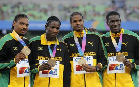 Bronze medalists Allodin Fothergill, Jermaine Gonzales, Riker Hylton and Leford Green of Jamaica (L to R) stand on the podium after their men's 4x400 meters relay event at the IAAF World Championships in Daegu September 3, 2011. REUTERS/Lee Jae-Won