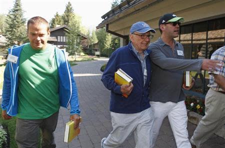 News Corp Chief Executive and Chairman Rupert Murdoch (C) and sons Lachlan Murdoch (L) and James Murdoch attend the Allen & Co Media Conference in Sun Valley, Idaho July 12, 2012. REUTERS/Jim Urquhart