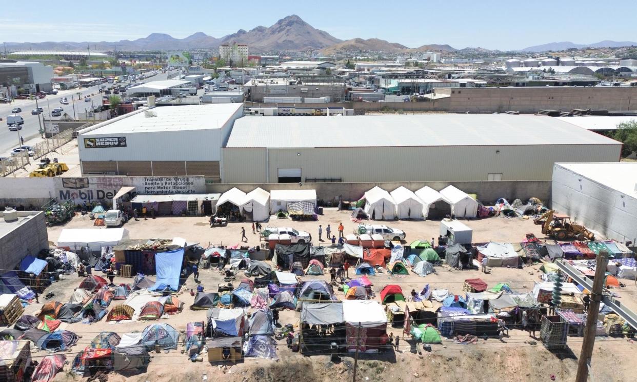 <span>Migrants in a temporary encampment in the south of Chihuahua, Mexico. ‘Displaced from their homes by increasing violence, climate change, hunger or a combination of these, they hope for a chance to seek safety in the US.’</span><span>Photograph: Anadolu/Getty Images</span>