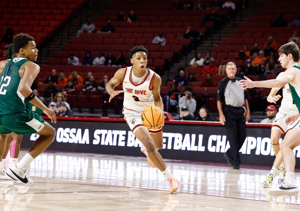 Booker T. Washington's Jamarri Simpson drives to the basket against Tulsa Edison during the second half of their 5A State Championship quarterfinal game at Lloyd Noble Center in Norman, Okla. on Thursday, March 7, 2024.