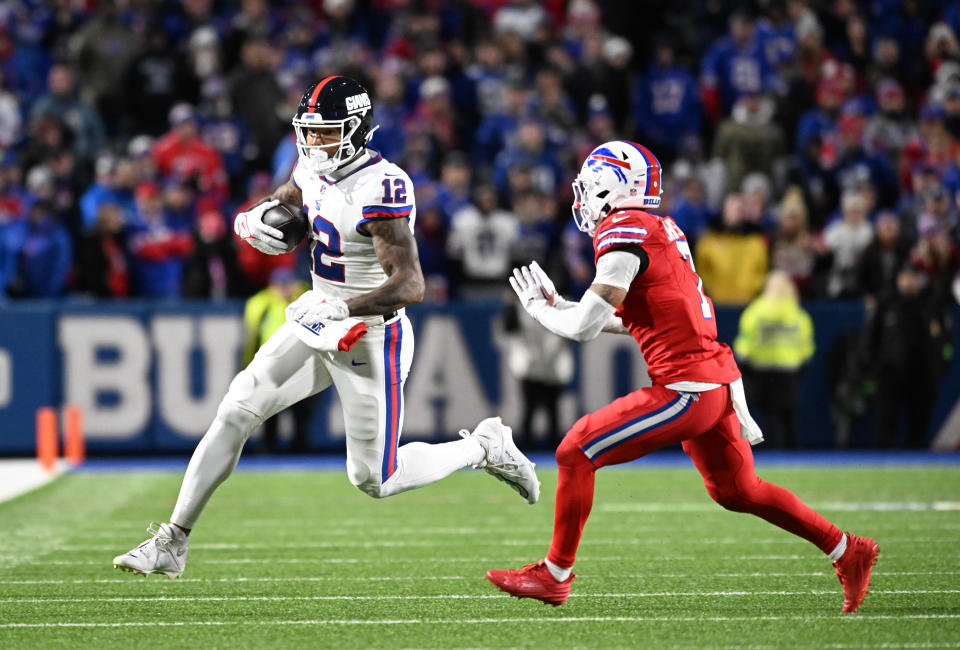 New York Giants tight end Darren Waller (12) gets out of bounds before being hit by Buffalo Bills cornerback <a class="link " href="https://sports.yahoo.com/nfl/players/31091" data-i13n="sec:content-canvas;subsec:anchor_text;elm:context_link" data-ylk="slk:Taron Johnson;sec:content-canvas;subsec:anchor_text;elm:context_link;itc:0">Taron Johnson</a> (7). Mandatory Credit: Mark Konezny-USA TODAY Sports