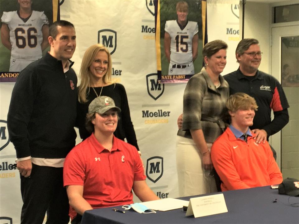 Luke Fickell and his wife, Amy, pose with son, Landon Fickell, left, in December 2020 as Landon signed with Cincinnati.