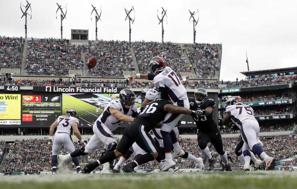 Denver Broncos’ Brock Osweiler is hit by Philadelphia Eagles’ Derek Barnett during the first half of Sunday’s game. (AP)