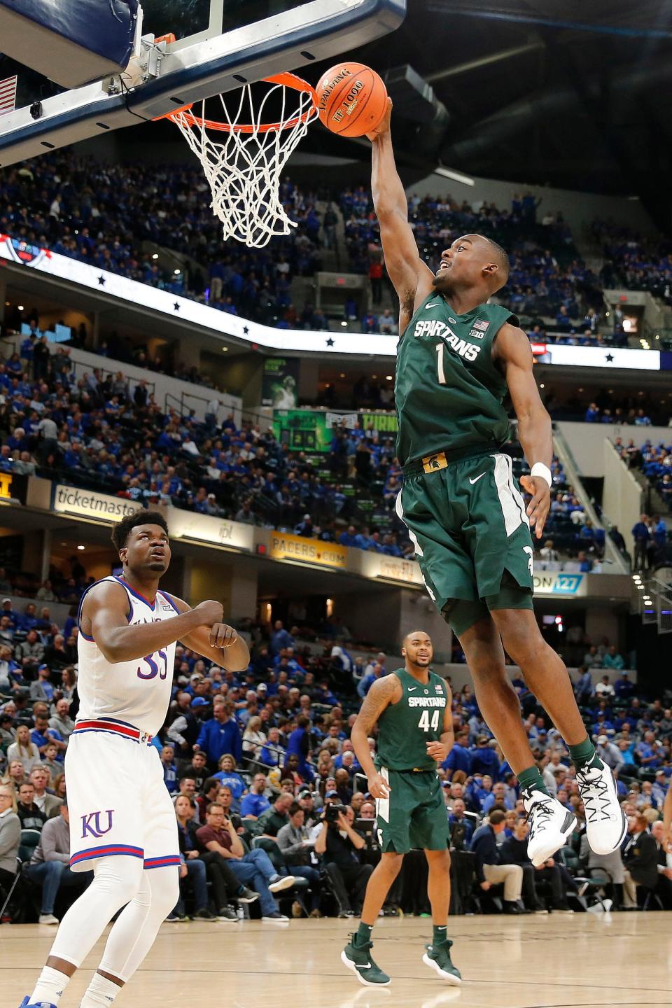 Michigan State Spartans guard Joshua Langford takes a shot past Kansas Jayhawks center Udoka Azubuike in the second half during the Champions Classic at Bankers Life Fieldhouse, Tuesday, Nov. 6, 2018.