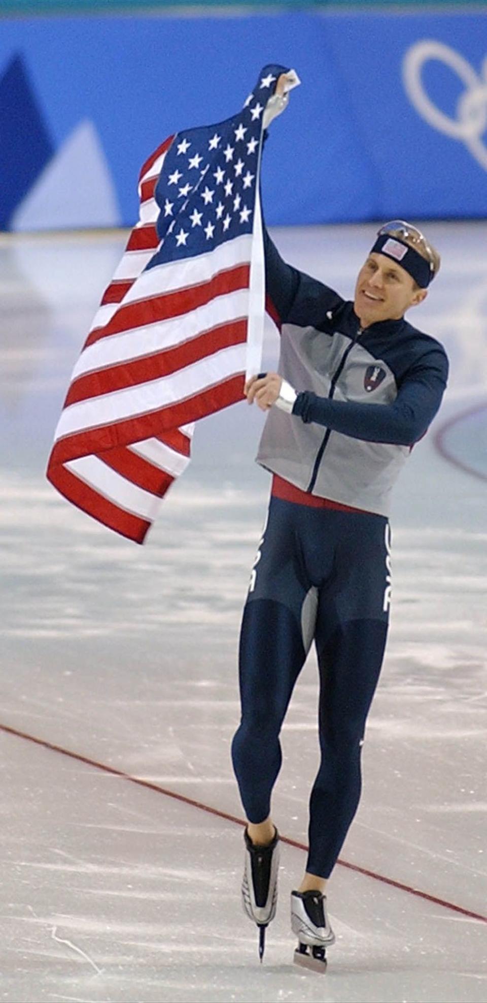 USA’s Casey Fitzrandolph holds a American flag after the second day of men’s racing in the 500 meter on Feb. 12, 2002. Fitzrandolph won the gold. | Scott G Winterton, Deseret News