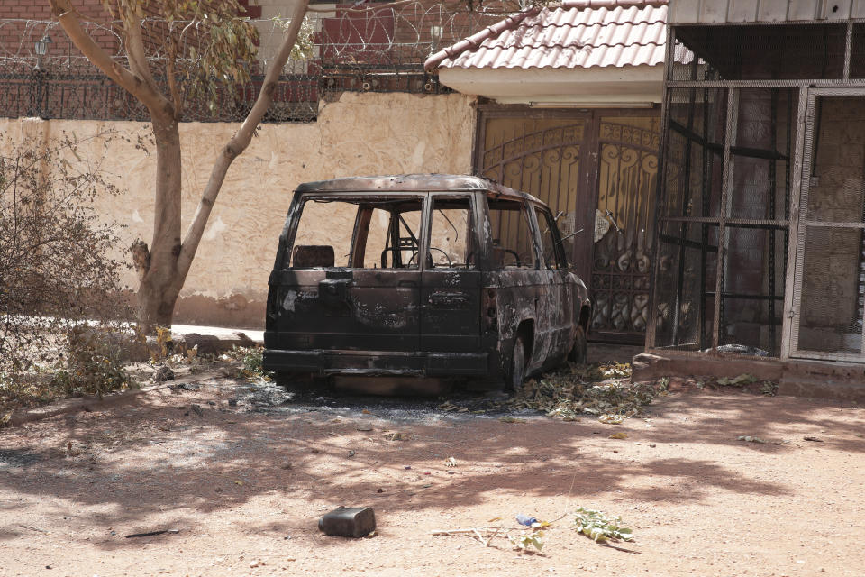 A destroyed vehicle is seen in southern in Khartoum, Sudan, Thursday, April 20, 2023. The latest attempt at a cease-fire between the rival Sudanese forces faltered as gunfire rattled the capital of Khartoum. Through the night and into Thursday morning, gunfire could be heard almost constantly across Khartoum. (AP Photo/Marwan Ali)