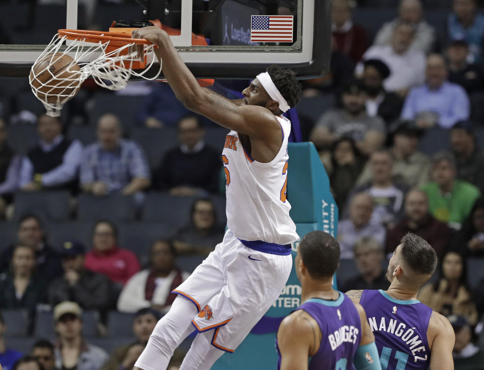 New York Knicks' Mitchell Robinson (26) dunks against the Charlotte Hornets during the first half of an NBA basketball game in Charlotte, N.C., Monday, Jan. 28, 2019. (AP Photo/Chuck Burton)