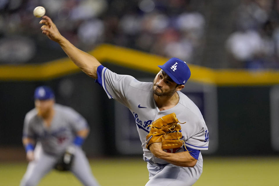 Los Angeles Dodgers pitcher Mitch White throws against the Arizona Diamondbacks during the first inning of a baseball game, Thursday, May 26, 2022, in Phoenix. (AP Photo/Matt York)