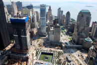 Construction continues at the World Trade Center site, New York. The skyscraper under construction at left is Four World Trade Center. The reflecting pool, lower center, is part of the National September 11 Memorial- July 19 2011