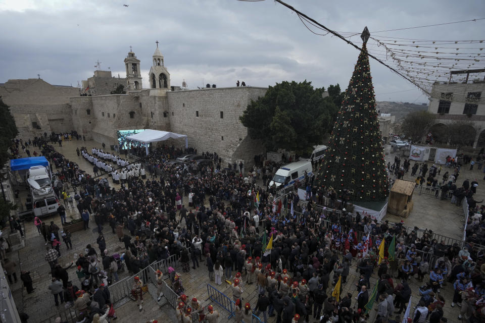 FILE - In this Saturday, Dec. 24, 2022, file photo, Latin Patriarch Pierbattista Pizzaballa greets worshippers in Manger Square, adjacent to the Church of the Nativity, traditionally believed to be the birthplace of Jesus Christ, in the West Bank town of Bethlehem during Christmas celebrations. (AP Photo/Mahmoud Illean)