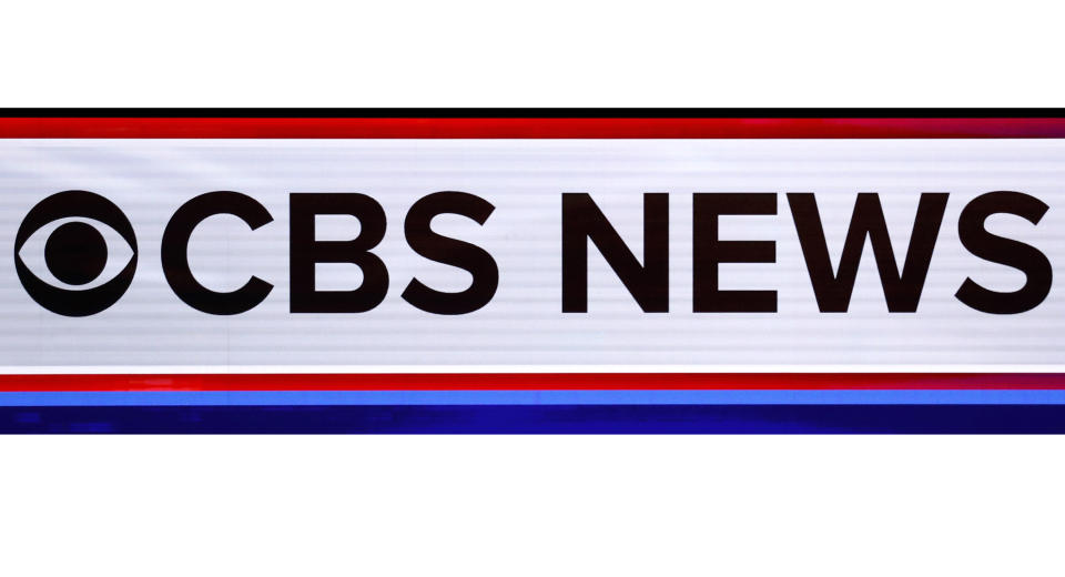 FILE - The CBS News Logo appears on stage at a Democratic presidential primary debate on Feb. 25, 2020, in Charleston, S.C.. CBS News says it is retooling its streaming service to better incorporate programs and personalities from the television network. The service debuts a new evening newscast on Monday, Jan. 24, 2022, along with a series of prime-time programs that make use of work done on "60 Minutes," "CBS Sunday Morning" and other shows (AP Photo/Patrick Semansky, File)