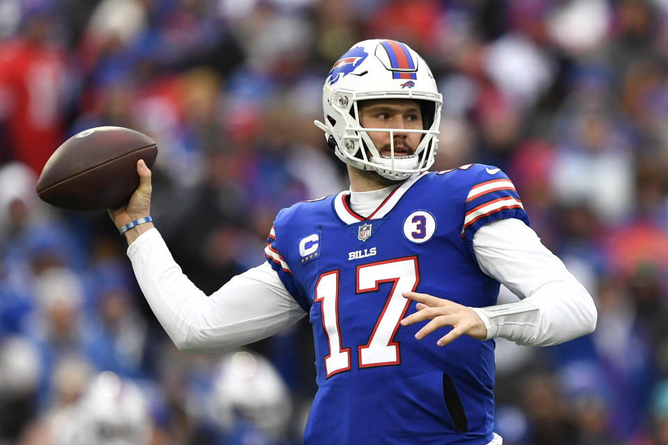 Buffalo Bills quarterback Josh Allen (17) passes during the first half of an NFL football game against the New England Patriots, Sunday, Jan. 8, 2023, in Orchard Park. (AP Photo/Adrian Kraus)