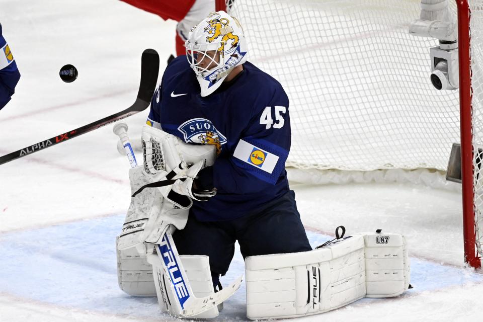 Finland goalie Jussi Olkinuora makes a save during the IIHF Ice Hockey World Championships preliminary round Group B match between Finland and Czechia in Tampere, Finland, on May 24, 2022.