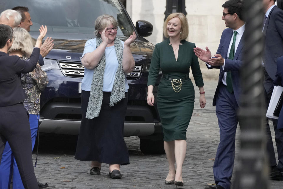 Britain's Secretary of State for Foreign, Commonwealth and Development Affairs, Liz Truss receives applause from her team near Parliament in London, Wednesday, July 20, 2022. Britain’s Conservative Party has chosen Rishi Sunak and Liz Truss as the two finalists in an election to replace Prime Minister Boris Johnson. The pair came first and second in a vote of Conservative lawmakers on Wednesday. (AP Photo/Frank Augstein)