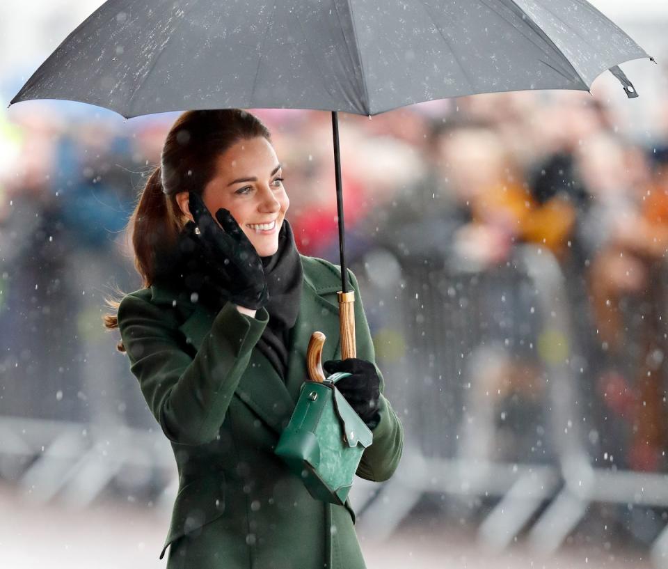 <p>If anyone knows how to deal with the rain, <a href="https://www.townandcountrymag.com/society/tradition/a26899647/queen-elizabeth-umbrellas-fulton-match-outfit/" rel="nofollow noopener" target="_blank" data-ylk="slk:the royal family does;elm:context_link;itc:0;sec:content-canvas" class="link ">the royal family does</a>. Here, the Duchess of Cambridge wields an umbrella like the best of them. </p>