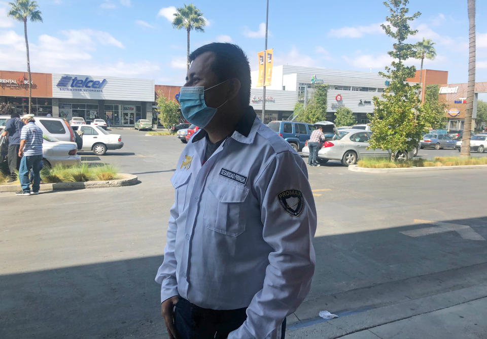 Edgar Alexis Lopez stands outside a market in Tijuana, Mexico on Oct. 10, 2020. President Donald Trump’s reshaping of U.S. immigration policy may be most felt in his undoing of asylum. “You enter and leave, enter and leave, enter and leave,” Lopez said.“You have nothing to lose besides the physical strain.” (AP Photo/Elliot Spagat)