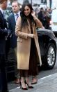 <p>For the visit, Meghan wrapped up in a Reiss <a href="https://www.elle.com/uk/fashion/what-to-wear/articles/g31087/best-camel-coats-to-buy-now-high-street-topshop-mango-warehouse/" rel="nofollow noopener" target="_blank" data-ylk="slk:camel coat;elm:context_link;itc:0;sec:content-canvas" class="link ">camel coat</a>, roll neck tan jumper, a <a href="https://www.net-a-porter.com/gb/en/product/1147632?gclsrc=aw.ds&gclsrc=aw.ds&cm_mmc=Google-ProductSearch-UK--c-_-NAP_EN_UK_PLA-_-NAP+-+UK+-+GS+-+Sale+-+1MD+-+Designer+-+FW19+-+CSS--Sale+-+Clothing_INTL&gclid=Cj0KCQiA9dDwBRC9ARIsABbedBN7UEdmY_HPJszYZ8jikEAxzuCUwTaP-8dzO1UcL2QiyUbav1hoGJMaAureEALw_wcB" rel="nofollow noopener" target="_blank" data-ylk="slk:Vince mahogany brown slip midi skirt;elm:context_link;itc:0;sec:content-canvas" class="link ">Vince mahogany brown slip midi skirt</a> and burgundy-coloured suede pumps by Jimmy Choo.</p><p>The visit to Canada House marked the royal's first with Prince Harry since their Christmas holidays spent in Canada in 2019. </p>
