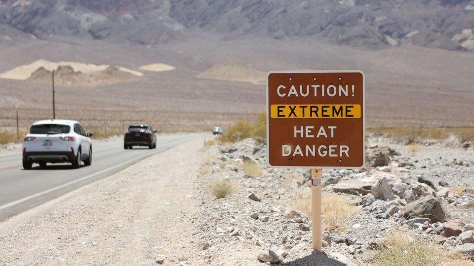 PHOTO: A heat advisory sign is shown along US highway 190 during a heat wave in Death Valley National Park, July 16, 2023, in Death Valley, Calif. (Ronda Churchill/AFP via Getty Images)