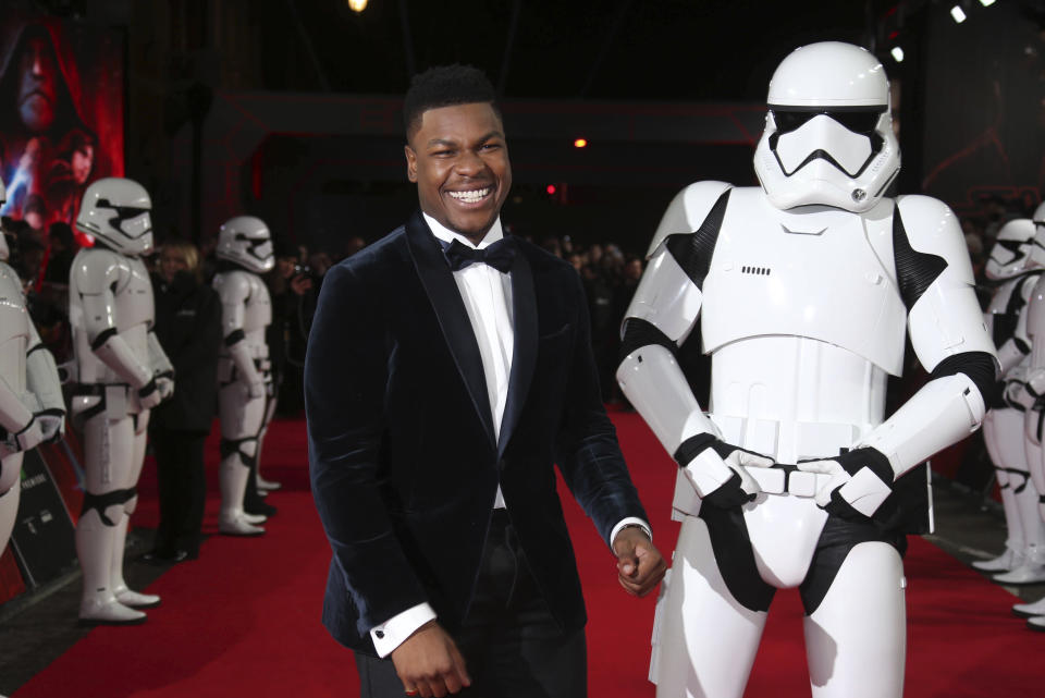 John Boyega poses for photographers upon arrival at the premiere of the film 'Star Wars: The Last Jedi' in London, Tuesday, Dec. 12th, 2017. (Photo by Joel C Ryan/Invision/AP)