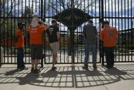 Fans sit outside Camden Yards ballpark before the start of the Baltimore Orioles against Chicago White Sox America League baseball game in Baltimore, Maryland April 29, 2015. In what will be a first for Major League Baseball, the Baltimore Orioles will host the Chicago White Sox on Wednesday in a stadium closed to fans as Baltimore copes with some of the worst U.S. urban rioting in years.REUTERS/Shannon Stapleton