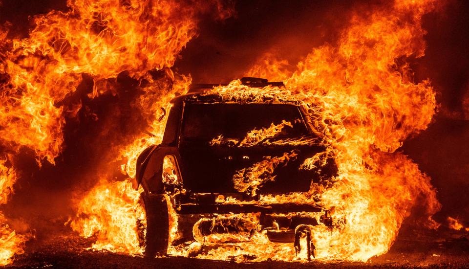 A car burns outside Vacaville, California, during the Lightning Complex fire (AFP/Getty)