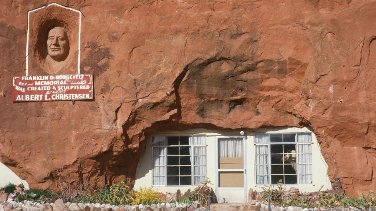 House built inside of a boulder and Franklin D.