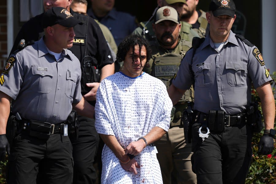 Law enforcement officers escort Danelo Cavalcante from a Pennsylvania State Police barracks in Avondale Pa., on Wednesday, Sept. 13, 2023. Cavalcante was captured Wednesday after eluding hundreds of searchers for two weeks. (AP Photo/Matt Rourke)