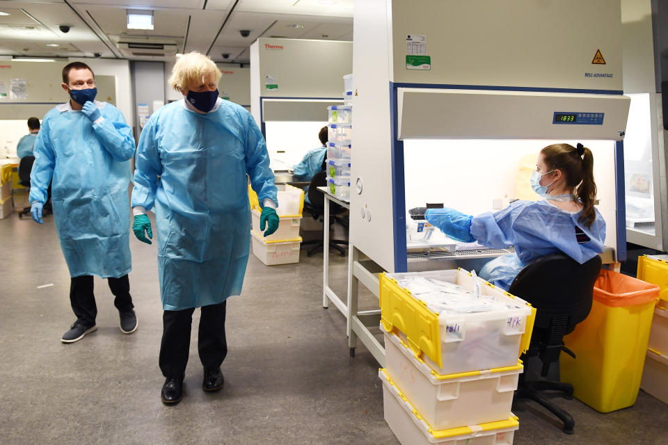 Prime Minister Boris Johnson is shown the Lighthouse Laboratory, used for processing polymerase chain reaction (PCR) samples for coronavirus, during a visit to the Queen Elizabeth University Hospital campus in Glasgow on his one day visit to Scotland. Picture date: Thursday January 28, 2021.