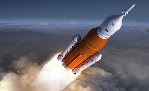 An artist's impression of an SLS rocket blasting off.  / Credit: NASA